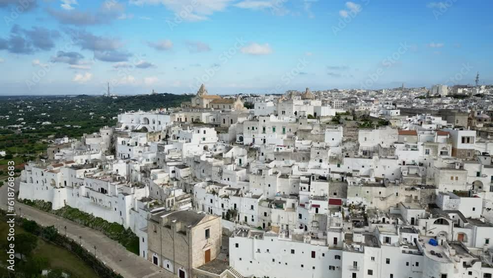 Aerial of the white buildings of Brindisi city in Italy under the blue sky Aerial of the white buildings of Brindisi city in Italy under the blue sky