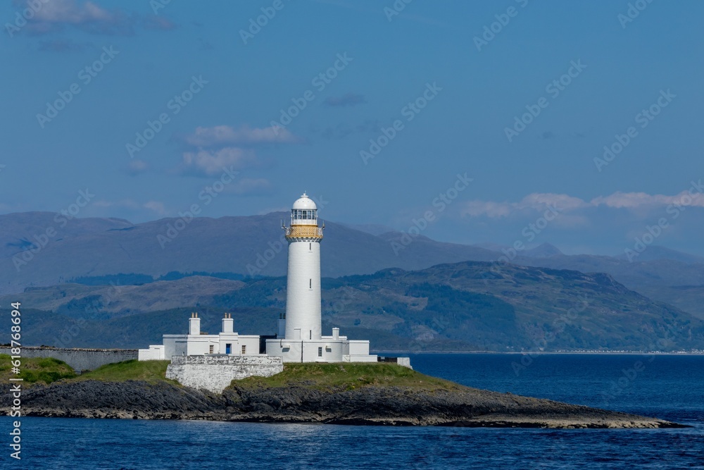 Lighthouse in the Firth of Lorne on the island of Eilean Musdile