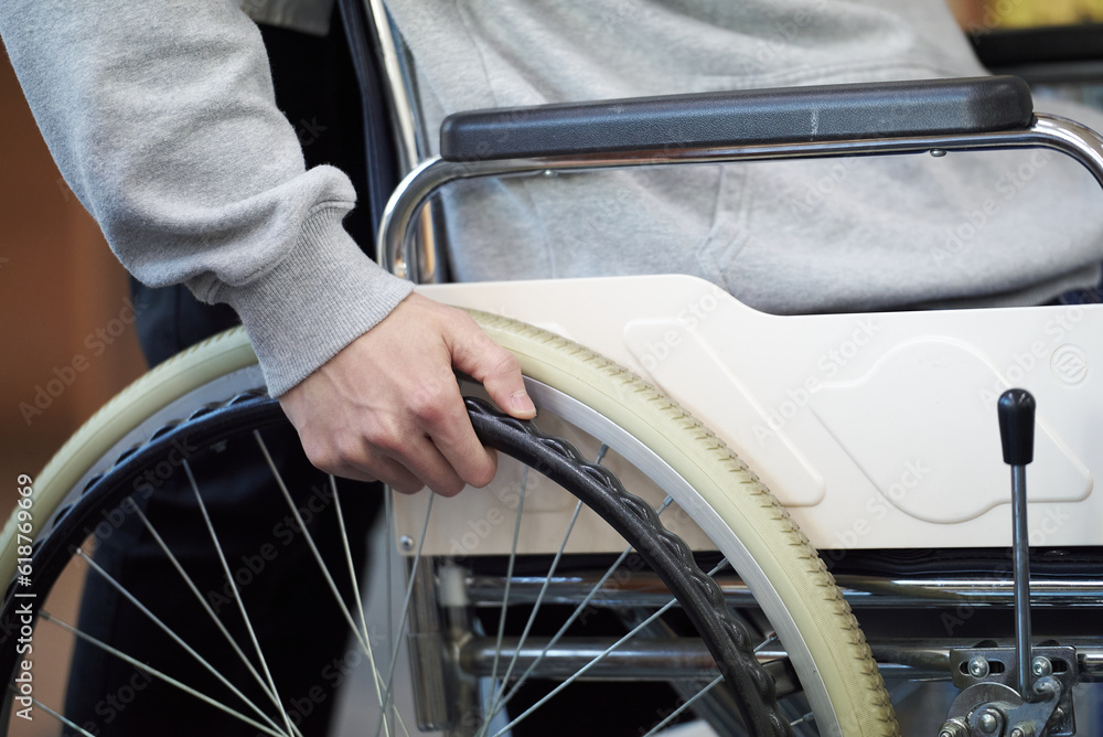 Close-up of hand holding wheelchair in Asia Korea Close-up of hand holding wheelchair in Asia Korea