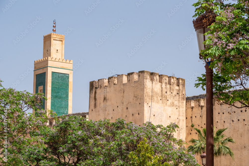 Strong old city wall around downtown Meknes, Lalla Aouda mosque in the background