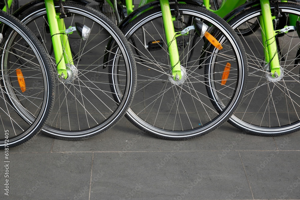 Closeup of green bicycles arranged in a raw Closeup of green bicycles arranged in a raw