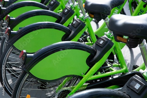 Closeup of green bicycles arranged in a raw