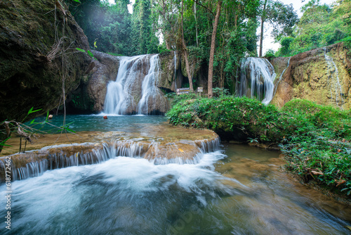 Waterfall in tropical rainforest with green tree forest in Phayao north of Thailand