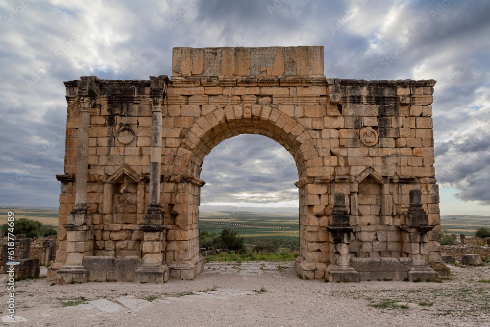 Iconic Triumphal Arch of Volubilis, an old ancient Roman city in Morocco