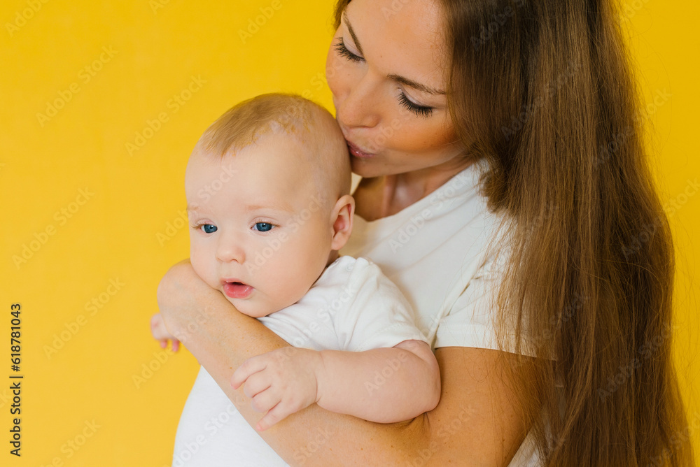 Loving mother takes care of a newborn baby Loving mother takes care of a newborn baby