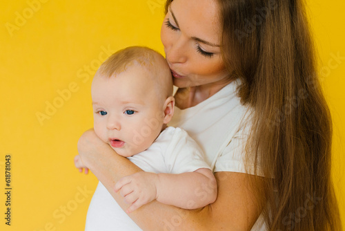 Loving mother takes care of a newborn baby