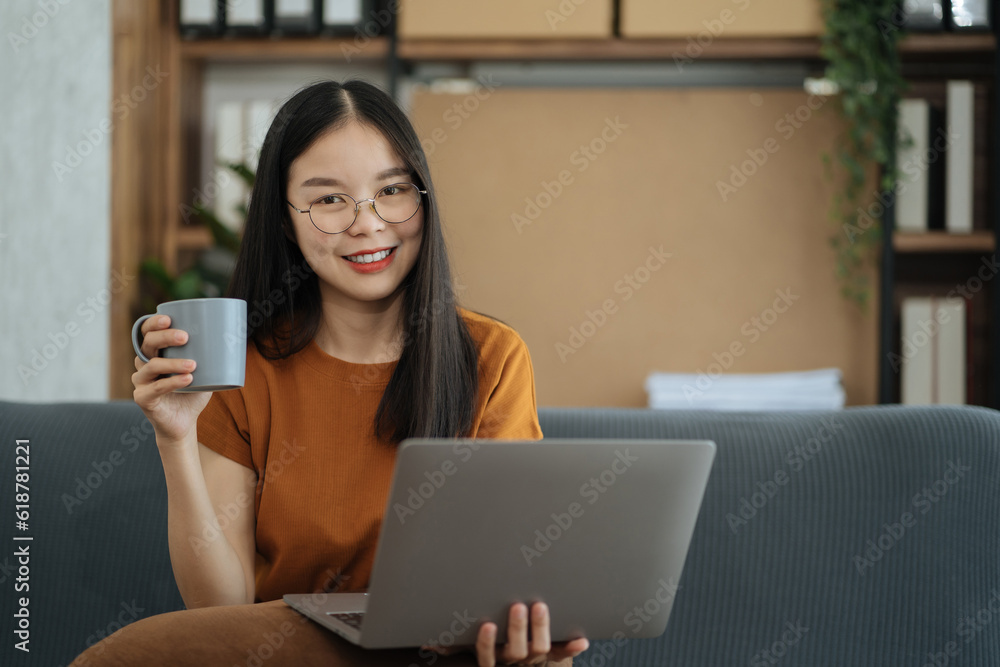 Female asian sitting at the desk, looking to camera. Female asian sitting at the desk, looking to camera.