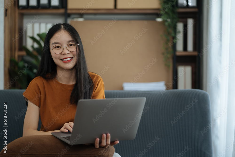 Female asian sitting at the desk, looking to camera. Female asian sitting at the desk, looking to camera.