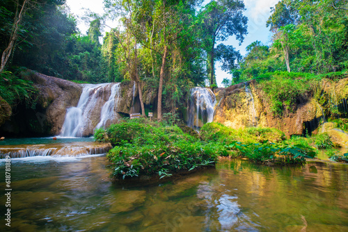 Fototapeta Naklejka Na Ścianę i Meble -  Waterfall in tropical rainforest with green tree forest in Phayao north of Thailand