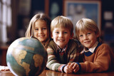 Group of different satisfied happy kids in geography lesson with globe