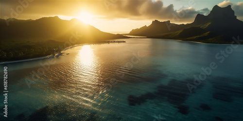 Calm waters of Bora Bora's Beach in golden rays of the sun over the ocean