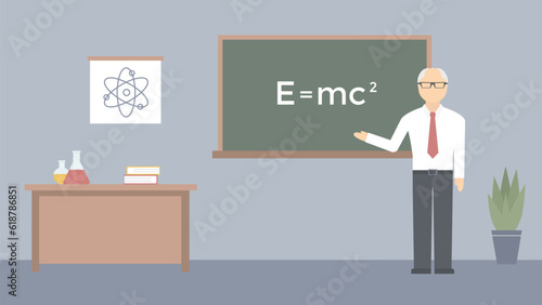 The physics teacher is standing at the board in the classroom. Lecture in a school or college.  