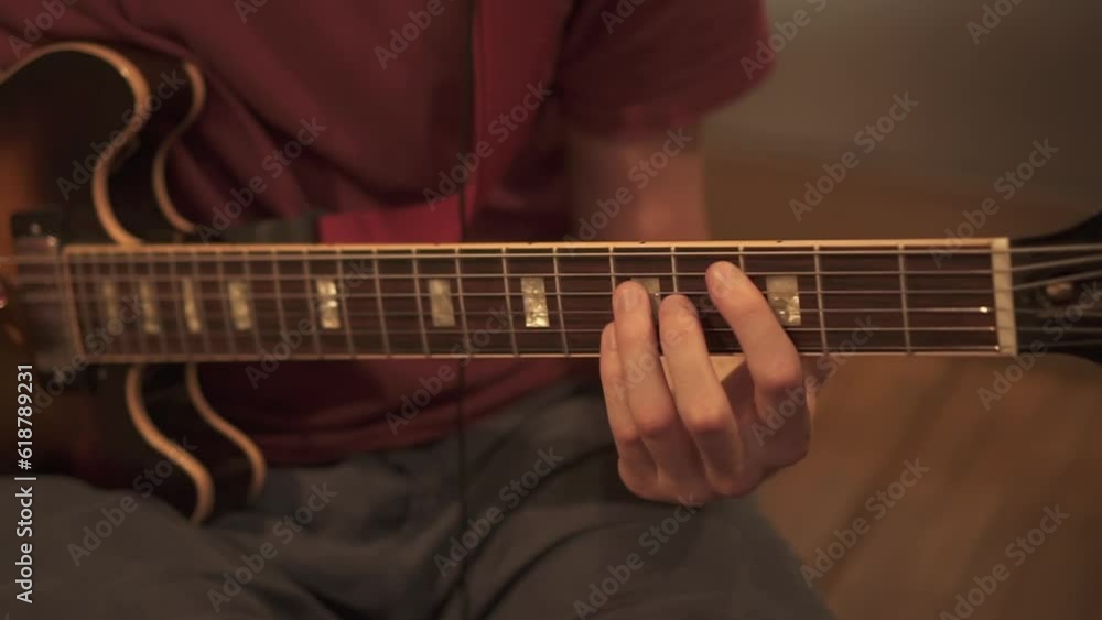 Hands play the electric guitar Hands play the electric guitar