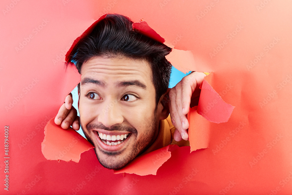 Man, studio and face breakthrough paper with smile, excited and ...