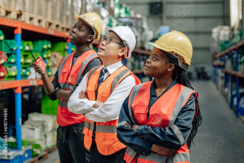 Shot of warehouse members collaborate daily to audit, examine inventory shipments. They organize and monitor storage, update checklists, and communicate effectively to ensure efficient distribution. © SpaceOak