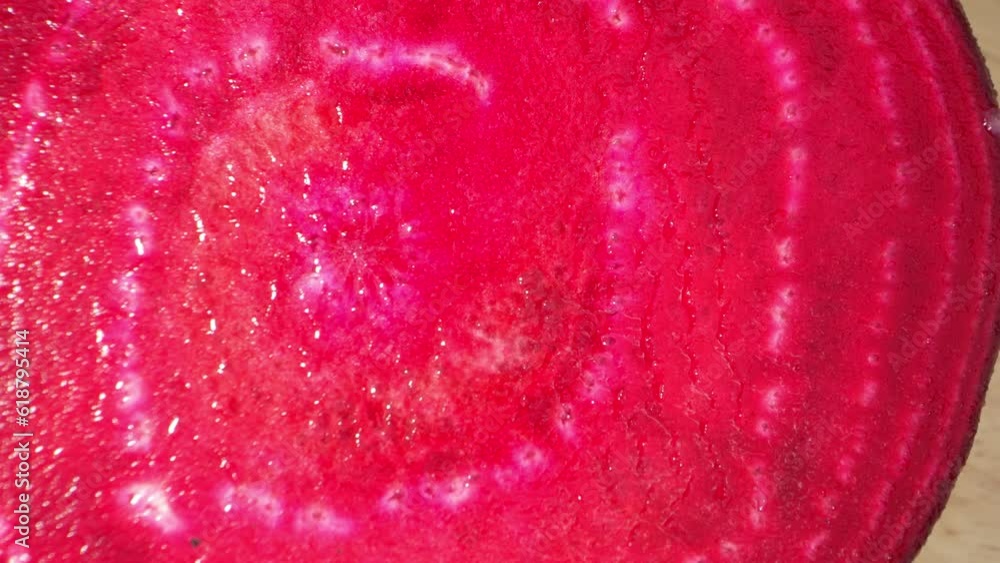 Half beetroot, filmed in macro with a probe lens, showcases intricate details of its vibrant crimson flesh, revealing the intricate patterns and textures within. Nature's beauty. Beetroot background
Half beetroot, filmed in macro with a probe lens, showcases intricate details of its vibrant crimson flesh, revealing the intricate patterns and textures within. Nature's beauty. Beetroot background