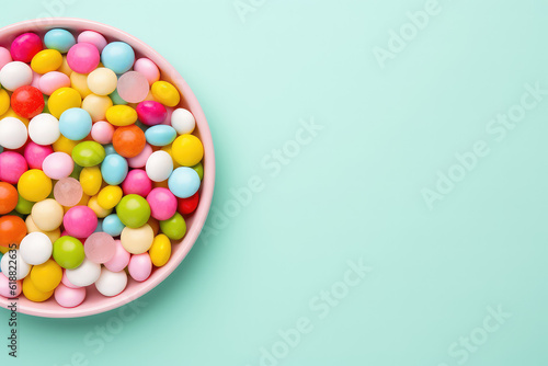 Top view lot of little round candy sweets isolated on a pastel blue background. Copy space for text, sweet candy banner template. Generative AI photo.