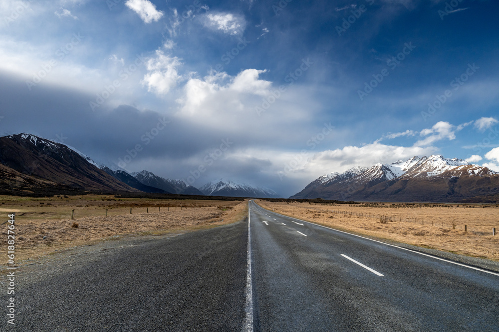 Naklejka premium Scenic view along the Mount Cook Road alongside with snow capped Southern Alps basking in the late winter evening light. Best road trip route in New Zealand South Island with majestic Mount Cook. 