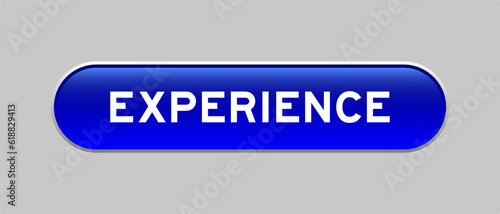 Blue color capsule shape button with word experience on gray background
