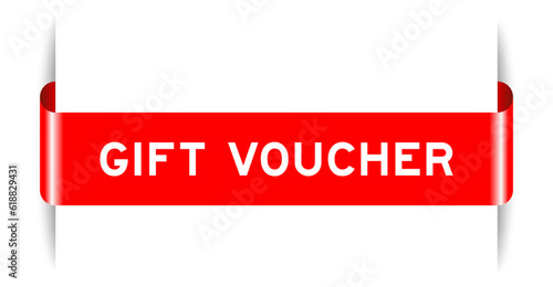 Red color inserted label banner with word gift voucher on white background