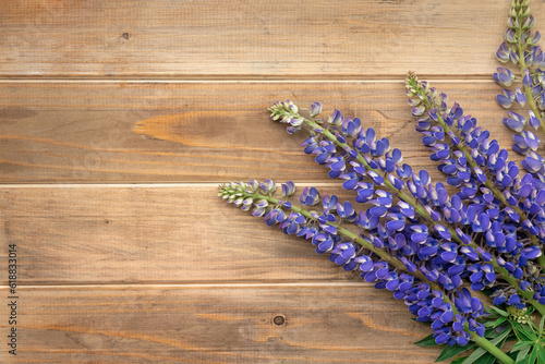 bouquet of flowers lupine on brown wooden table