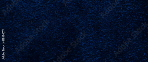 Classic blue dark suede texture for background, concrete of a blue wall background, grunge blue textured background, empty copy space for text, grunge canvas and any design related works.

