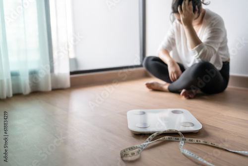 Фотография Sad woman with fat upset bored of dieting Weight loss fail  Fat diet and scale s