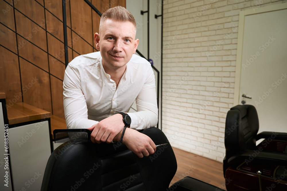 Fototapeta premium Barber blonde is at the excellent lighting workplace