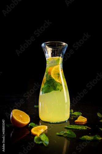Moxitto. Limonad. Fresh. Mojito juice in a glass jar, on a black background