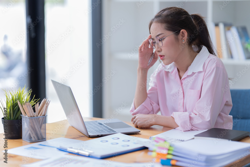 Young woman happy and screaming because of problems with documents in the office. Young woman happy and screaming because of problems with documents in the office.