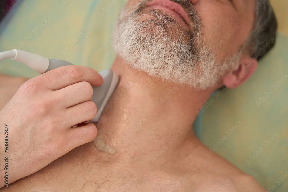 Physician doing diagnosis of neck of patient Physician doing diagnosis of neck of patient