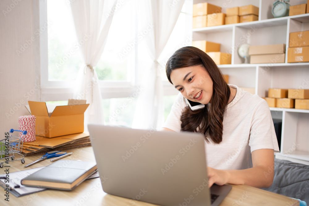 Business owner on the phone talking to a customer, Business owner taking orders from laptop, Packaging and Delivery, Packaging and Shipping.