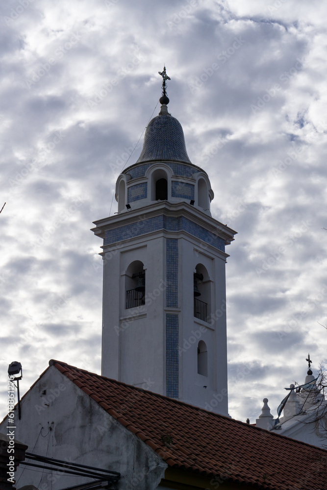 Cloudy sky and church towe
