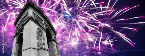 Celebratory colorful fireworks over the Arc de Triomphe, Paris, France. The walls of the arch are engraved with the names of 128 battles and names of 660 French military leaders (in French) photo