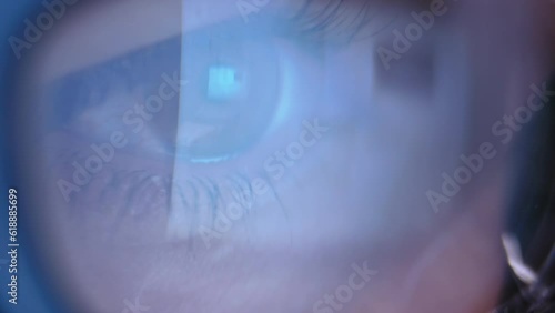 Intense Close-up of Woman's Eyes Wearing Glasses Engrossed in Internet Surfing, with the Monitor's Display Elegantly Reflected in Her Eyewear