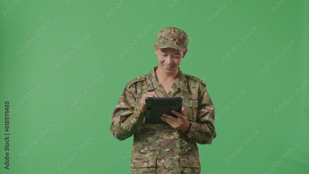 Asian Man Soldier Taking Note On A Tablet While Standing In The Green Screen Background Studio
Asian Man Soldier Taking Note On A Tablet While Standing In The Green Screen Background Studio