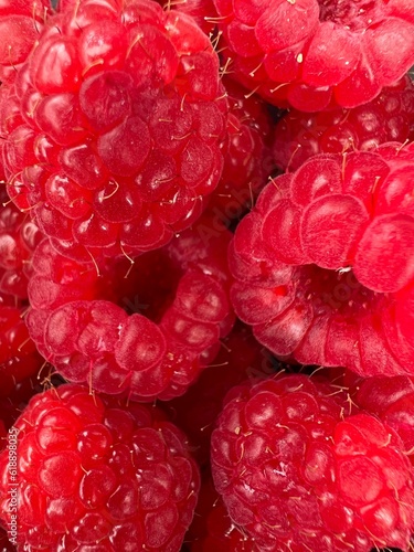 ripe large raspberries close-up on the table