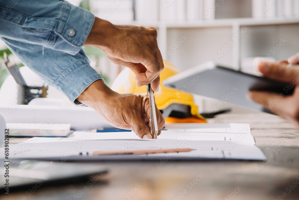 custom made wallpaper toronto digitalConstruction and structure concept of engineer working drawing on blueprint meeting for project working with partner on model building and engineering tools in working site, construction concept.