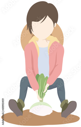 カブを収穫する女性
