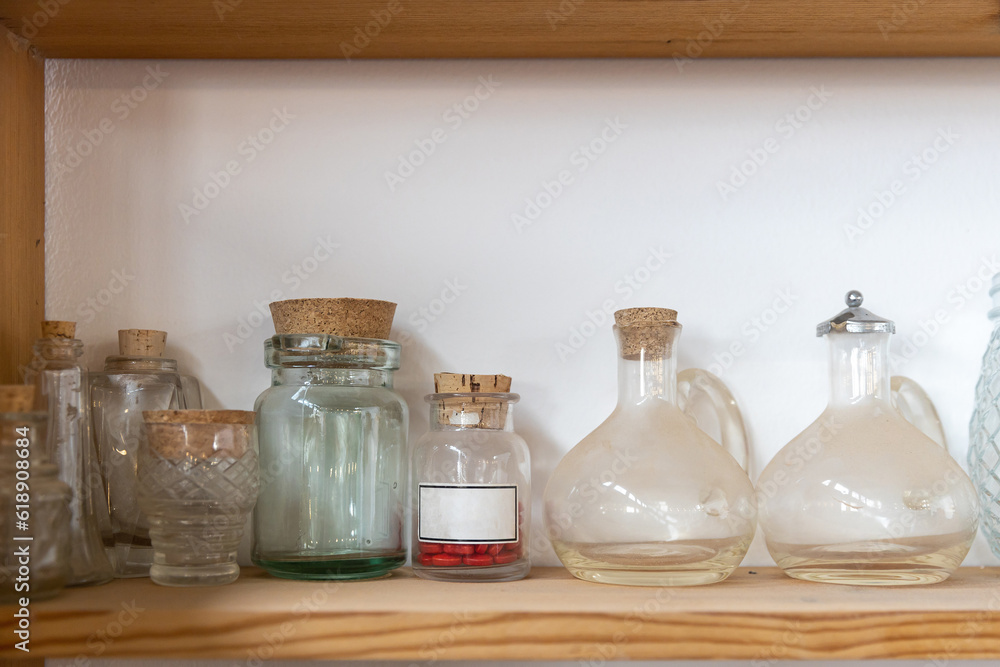 Glass jars of various shapes and sizes in an antique shop decorate the interior Glass jars of various shapes and sizes in an antique shop decorate the interior