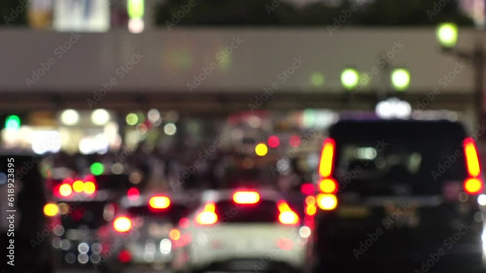 SHIBUYA, TOKYO, JAPAN - JUNE 2023 : View of crowd of people walking around SHIBUYA STATION at night. Busy downtown area in Tokyo. Japanese people, city life and traffic concept video. Time lapse shot. SHIBUYA, TOKYO, JAPAN - JUNE 2023 : View of crowd of people walking around SHIBUYA STATION at night. Busy downtown area in Tokyo. Japanese people, city life and traffic concept video. Time lapse shot.