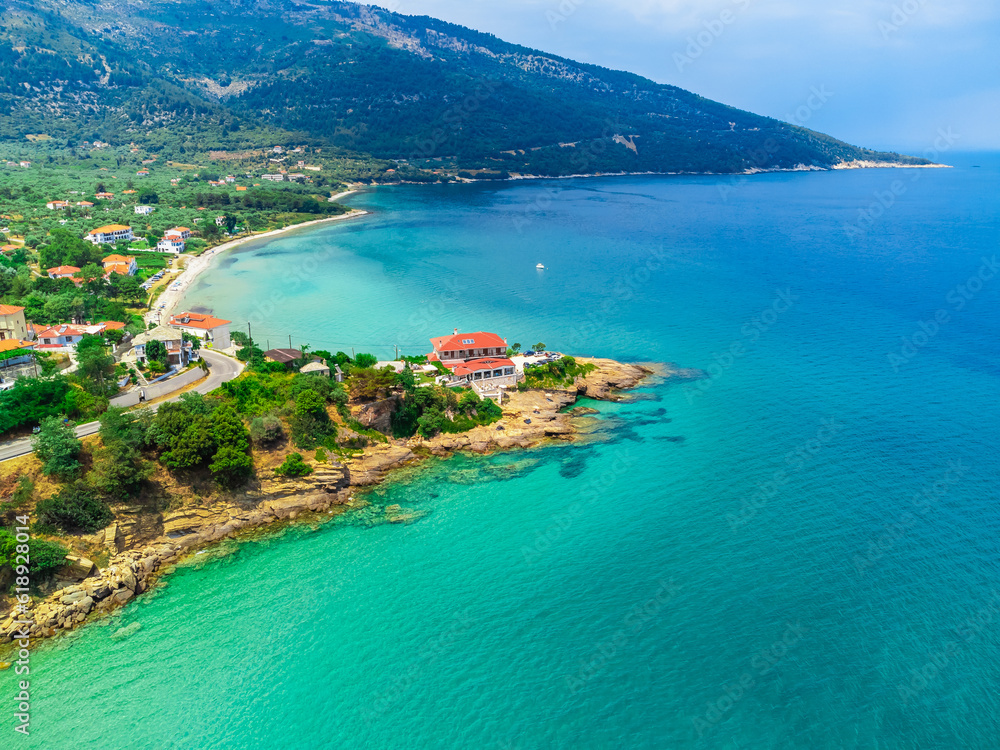 Beach, small village, turquoise water. Kinira Beach, Thassos, Greece