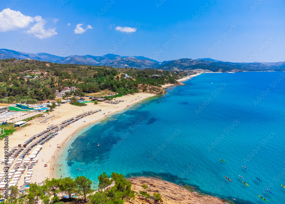 Beach and turquoise sea, umbrellas. Trypiti Beach, Thassos, Greece