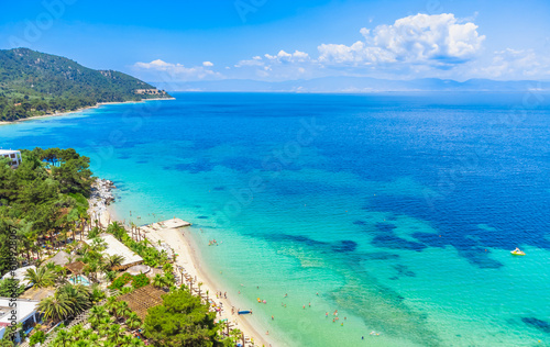 Beach and turquoise sea, palm trees. La Scala Beach, Thassos, Greece © oleg_p_100