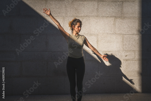 One adult caucasian woman doing yoga practice in summer day outdoor