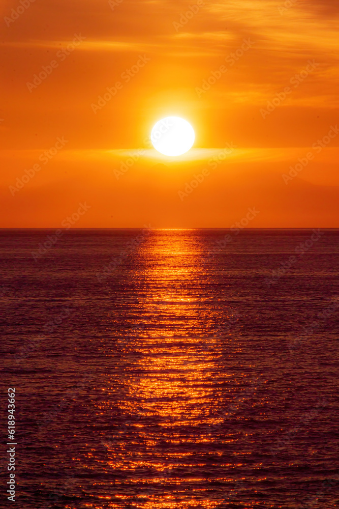 Orange sunset with ocean and a neverending horizon