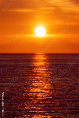 Orange sunset with ocean and a neverending horizon