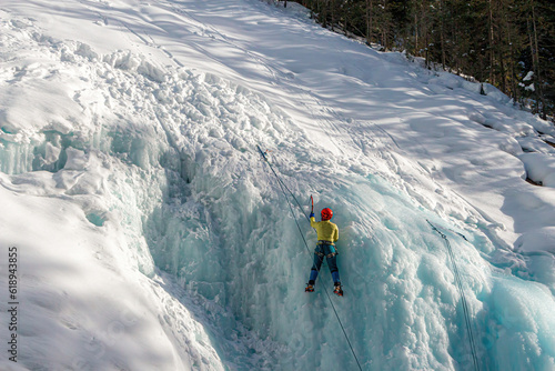 Ice climber on a frozen waterfall