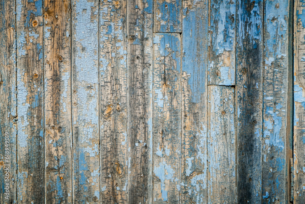 Dark stained reclaimed wood surface with aged boards lined up. Wooden