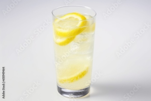 refreshing summer lemonade in frosted glass on white background, created with generative ai